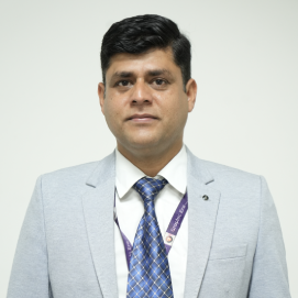 vipin-chandra-cse-hld Professional headshot: man in a light gray suit, white shirt, and blue patterned tie, facing the camera against a neutral background.