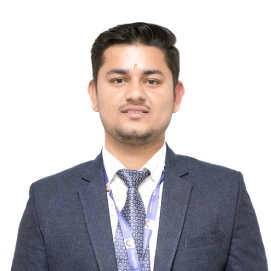 yogesh-bhatt-csa-hld Professional portrait of a man in a navy suit and tie with a lanyard, against a white background.